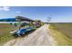 Community kayak racks along a picturesque waterfront trail with marsh views and clear skies at 2734 Battle Trail Dr, Johns Island, SC 29455