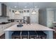 Spacious kitchen island with counter seating, stainless steel appliances and pendant lights at 2734 Battle Trail Dr, Johns Island, SC 29455