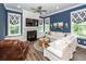 Cozy living room with fireplace, built-ins, and comfortable seating area at 2734 Battle Trail Dr, Johns Island, SC 29455