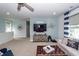Stylish living room featuring a tv and decorative octopus on the wall, and comfortable seating at 2734 Battle Trail Dr, Johns Island, SC 29455
