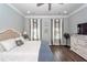 Well-lit main bedroom with hardwood floors, neutral decor, and modern amenities for a relaxing atmosphere at 2734 Battle Trail Dr, Johns Island, SC 29455