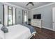 Comfortable main bedroom with modern ceiling fan, ample closet space, and hardwood flooring at 2734 Battle Trail Dr, Johns Island, SC 29455
