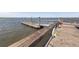 View of Pier with a life preserver with views of water and marsh at 2734 Battle Trail Dr, Johns Island, SC 29455