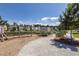 Community playground with natural play elements and lagoon view at 2734 Battle Trail Dr, Johns Island, SC 29455