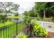 Backyard with scenic pond views framed by lush greenery and mature trees at 2734 Battle Trail Dr, Johns Island, SC 29455