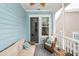 Relaxing screened porch featuring comfortable seating with blue decor, wood flooring, and a ceiling fan at 2734 Battle Trail Dr, Johns Island, SC 29455