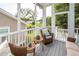 Relaxing screened porch with comfortable wicker furniture and neighborhood view at 2734 Battle Trail Dr, Johns Island, SC 29455