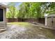 Backyard with a fence, a storage shed and a table in the yard at 2924 Alabama Dr, North Charleston, SC 29405
