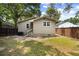 Backyard with some green grass, fence, trees, and a exterior view of the home at 2924 Alabama Dr, North Charleston, SC 29405