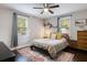 Relaxing bedroom with ceiling fan, comfy bed and well-lit windows at 2924 Alabama Dr, North Charleston, SC 29405