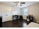 Bedroom with hardwood floors, ceiling fan, study desk, closet, and natural light from the window at 2924 Alabama Dr, North Charleston, SC 29405
