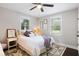 Cozy bedroom with a ceiling fan, natural light, decorative rug, and comfortable bedding at 2924 Alabama Dr, North Charleston, SC 29405