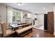 An inviting dining area with modern table, chairs, and kitchen with updated cabinets and sleek appliances at 2924 Alabama Dr, North Charleston, SC 29405