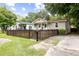 A charming fenced home with a yard and driveway at 2924 Alabama Dr, North Charleston, SC 29405