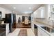 An open kitchen layout with a view of the dining area, complete with sleek appliances and granite countertops at 2924 Alabama Dr, North Charleston, SC 29405