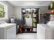 Laundry room featuring modern washer and dryer, storage shelving and natural light at 2924 Alabama Dr, North Charleston, SC 29405