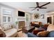 A comfy living room with a ceiling fan, decorative fireplace, and lots of seating for relaxing or entertaining at 2924 Alabama Dr, North Charleston, SC 29405