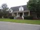 Charming single-story brick home with a covered entrance and well-maintained landscaping at 301 Archibald Dr, Goose Creek, SC 29445