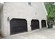 Three-car garage featuring black doors at 301 Archibald Dr, Goose Creek, SC 29445
