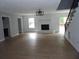 Spacious living room with hardwood floors, a fireplace, and ample natural light at 301 Archibald Dr, Goose Creek, SC 29445