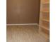 Neutral room with wood-look flooring and built-in shelving at 301 Archibald Dr, Goose Creek, SC 29445