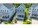 Aerial view showcases a charming home with a cozy front porch and well-maintained landscaping in a vibrant neighborhood at 3016 Evening Tide Dr, Hanahan, SC 29410