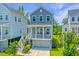 Inviting two-story home with a charming covered porch and garage at 3016 Evening Tide Dr, Hanahan, SC 29410