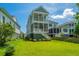 Beautiful home with multi-story outdoor patios, pristine lawn, and manicured landscaping in a serene setting at 3016 Evening Tide Dr, Hanahan, SC 29410