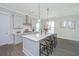 Bright kitchen with a center island, pendant lighting, and modern countertops at 3016 Evening Tide Dr, Hanahan, SC 29410