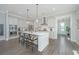Spacious kitchen with island seating, stainless steel appliances, and bright, open layout at 3016 Evening Tide Dr, Hanahan, SC 29410
