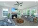 Cozy living room features a fireplace, comfortable seating, and bright natural light at 3016 Evening Tide Dr, Hanahan, SC 29410