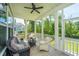 Relaxing screened porch with comfortable seating and a view of the backyard at 3016 Evening Tide Dr, Hanahan, SC 29410