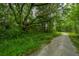 Scenic walking path winding through lush greenery, providing a peaceful retreat and connection with nature at 3016 Evening Tide Dr, Hanahan, SC 29410