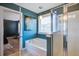 Bright bathroom featuring a tub, shower with glass door, and modern fixtures at 3306 Hartwell St, Johns Island, SC 29455