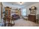 Charming bedroom with eclectic furniture, antique cabinets and lots of natural light at 3306 Hartwell St, Johns Island, SC 29455
