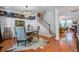 Elegant dining room open to staircase features chandelier, stylish wallpaper, and hardwood floors at 3306 Hartwell St, Johns Island, SC 29455