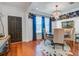 Elegant dining room boasts a chandelier, stylish wallpaper, and hardwood floors at 3306 Hartwell St, Johns Island, SC 29455