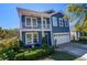 Beautiful blue home with white trim, complemented by manicured landscaping and inviting front porch at 3306 Hartwell St, Johns Island, SC 29455