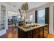 Kitchen island featuring granite countertops, stainless steel sink, and open view to the living room at 3306 Hartwell St, Johns Island, SC 29455