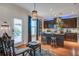 Eat-in kitchen with bar seating, dark cabinetry, stainless steel appliances, and adjacent breakfast area at 3306 Hartwell St, Johns Island, SC 29455
