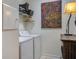 Well-lit laundry room with washer, dryer, shelving, and storage solutions at 3306 Hartwell St, Johns Island, SC 29455