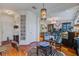 Comfortable living room with zebra rug, pendant light, and seating, transitioning to dining area at 3306 Hartwell St, Johns Island, SC 29455