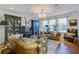 Cozy living room featuring leather sofas, hardwood floors, and built-in display cabinets at 3306 Hartwell St, Johns Island, SC 29455