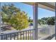 Scenic view from the balcony overlooking lush trees, a tranquil pond, and charming neighborhood homes at 3306 Hartwell St, Johns Island, SC 29455