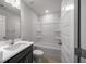 Bathroom featuring a vanity with a sink, toilet, and a shower-tub combo with tiled walls at 331 Bremerton Dr, Goose Creek, SC 29445
