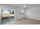 Bright bedroom features a sliding glass door, a double window, hardwood floors, and neutral paint at 331 Bremerton Dr, Goose Creek, SC 29445