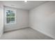 Bedroom with neutral carpet, trim, paint, and a window providing natural light at 331 Bremerton Dr, Goose Creek, SC 29445