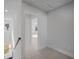 Bright hallway with neutral carpet leading to a bedroom with a ceiling fan, and natural light through the window at 331 Bremerton Dr, Goose Creek, SC 29445