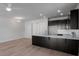 Modern kitchen featuring dark cabinets, a spacious island, stainless steel appliances, and hardwood floors at 331 Bremerton Dr, Goose Creek, SC 29445