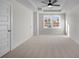 A bright bedroom featuring carpeted floors, a ceiling fan, and a window at 337 Bremerton Dr, Goose Creek, SC 29445